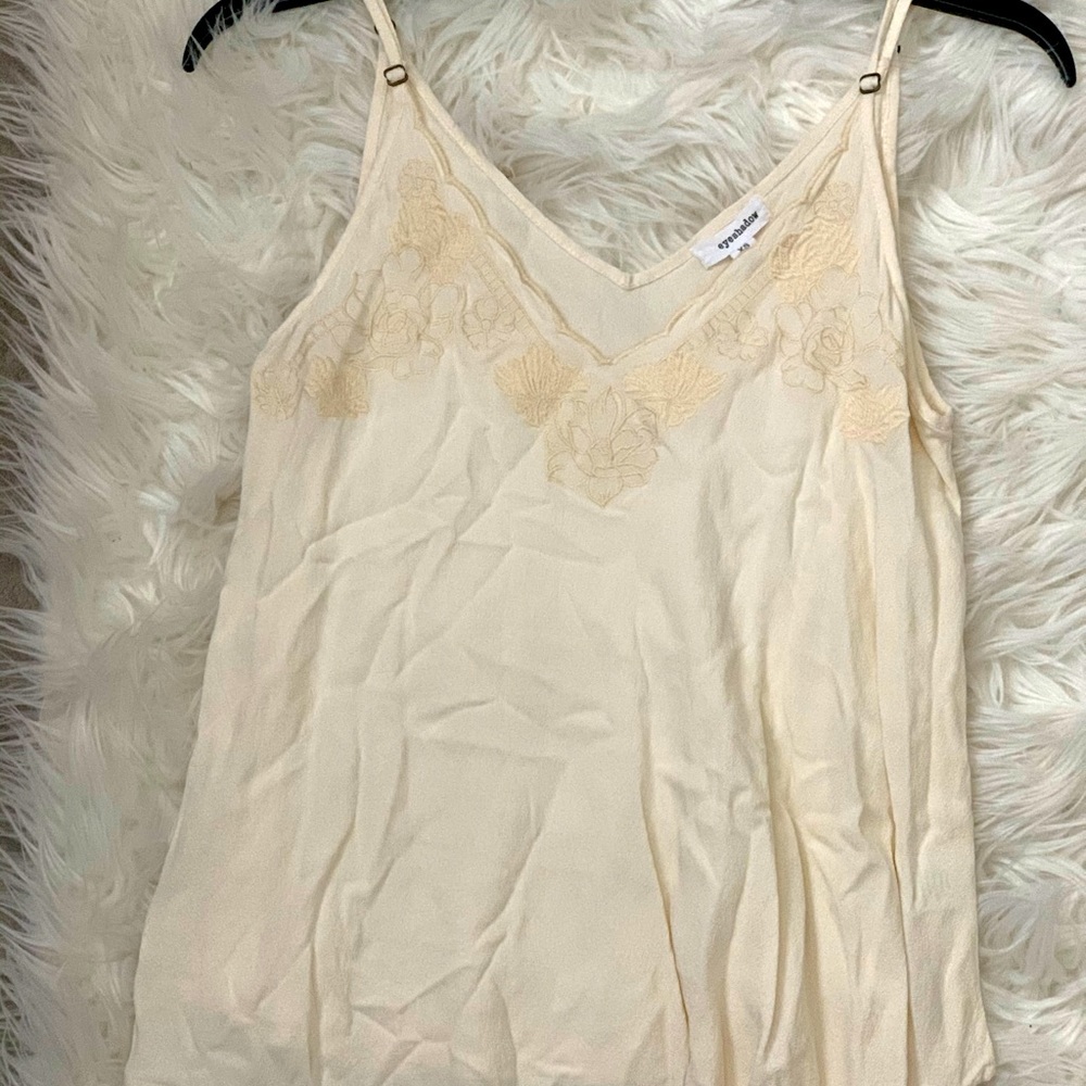 Sleeveless white blouse